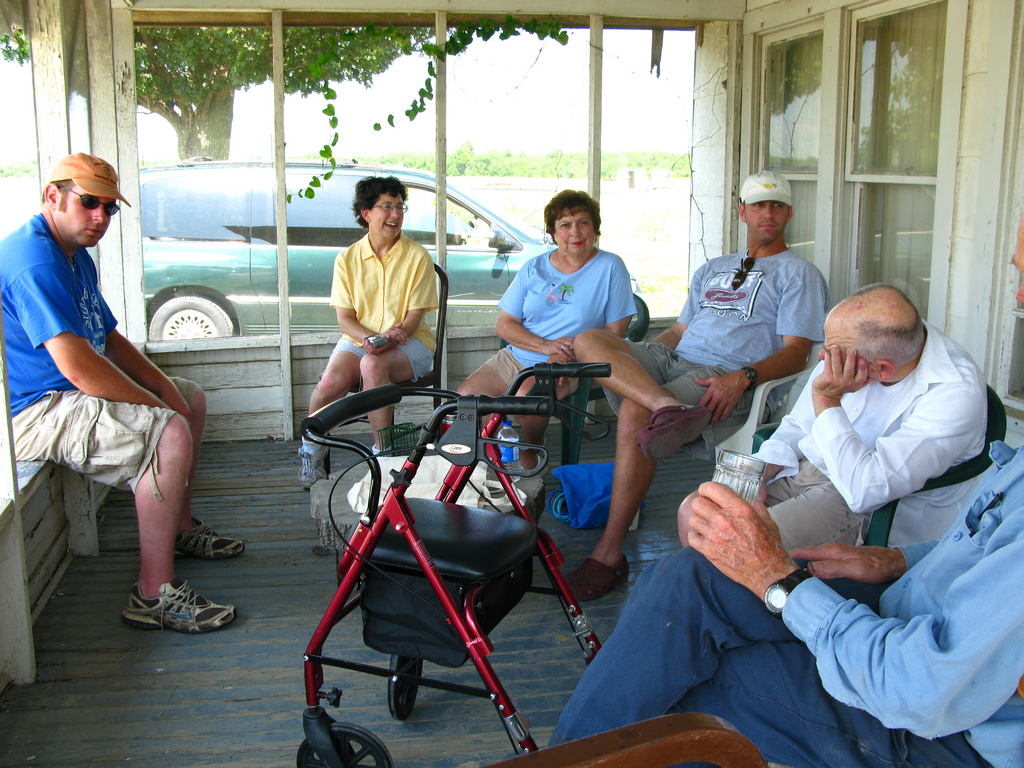 Close friends visiting informally and remembering times shared with their loved one.